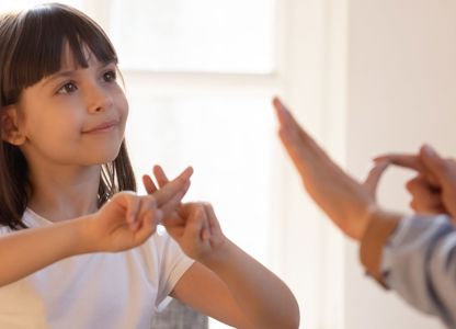 People communicating with British sign language