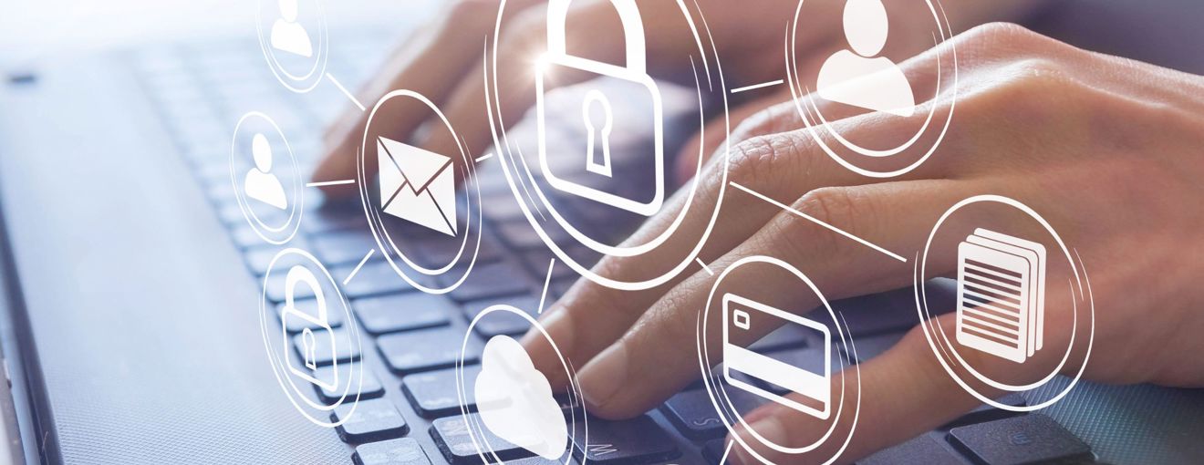 A person typing on their laptop with a digital graphic overlay