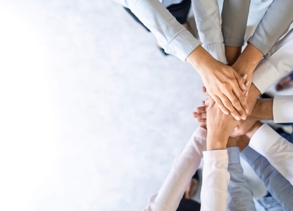 People putting their hands in the middle