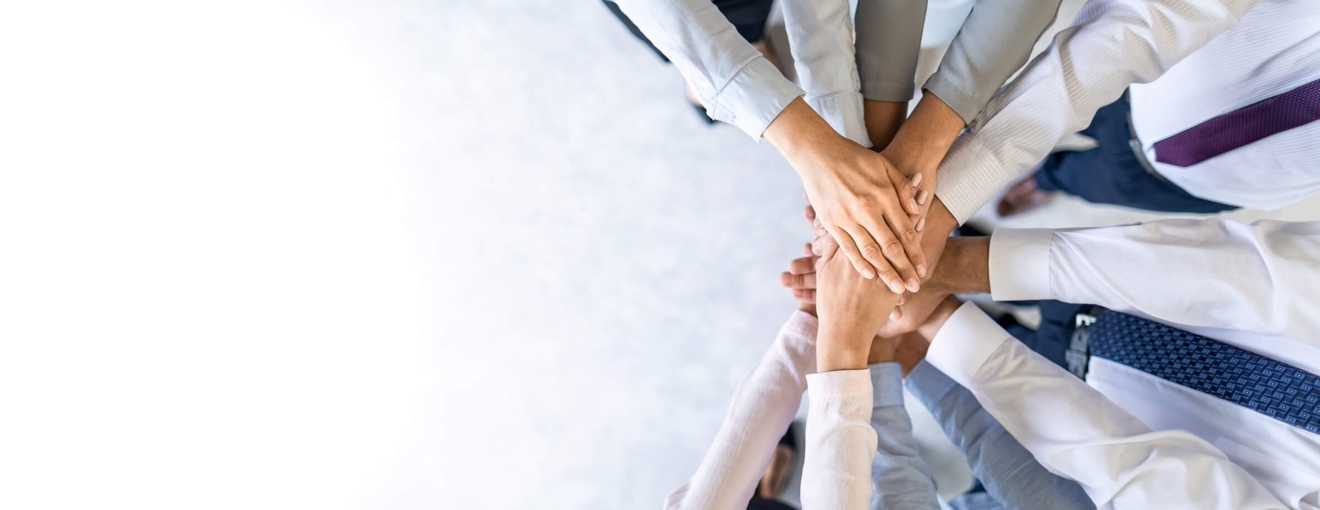 People putting their hands in the middle