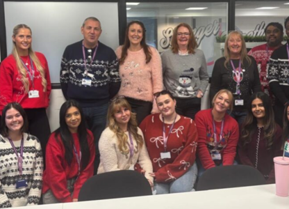 procurement services team wearing festive jumpers