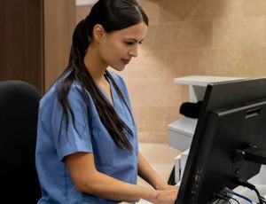Hospital worker using a computer