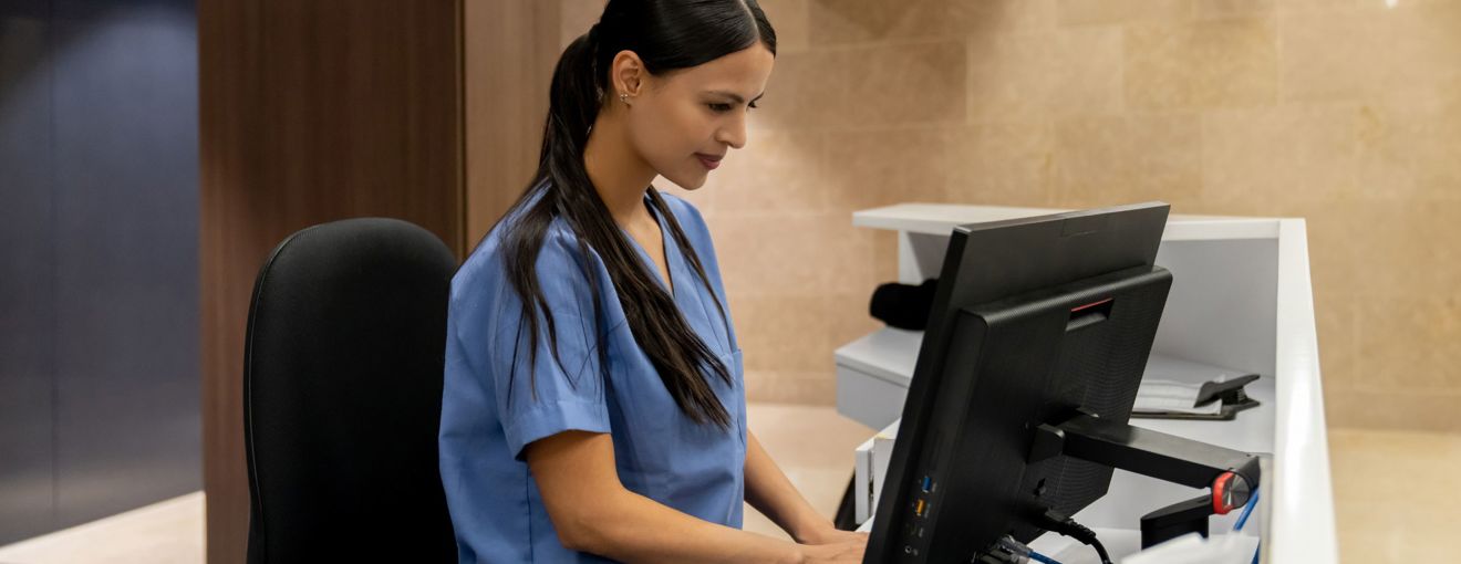 Hospital worker using a computer