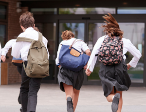School children running in the playground