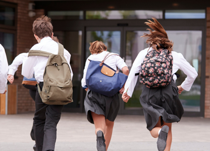 School children running in the playground